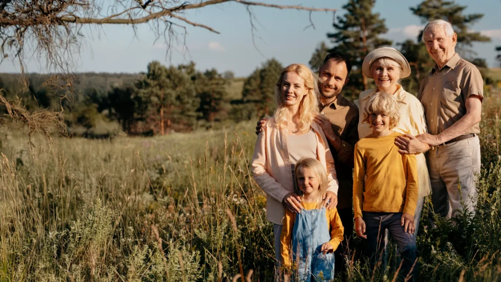 full shot happy family outdoors 16 9