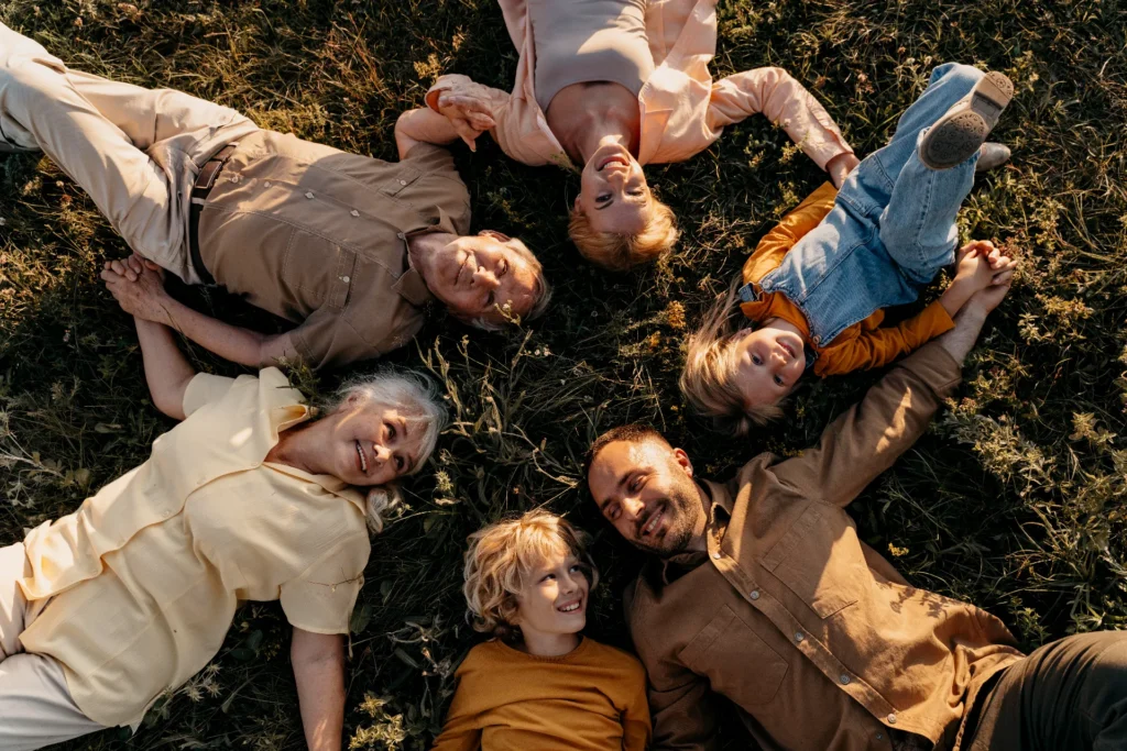 medium shot smiley people laying grass