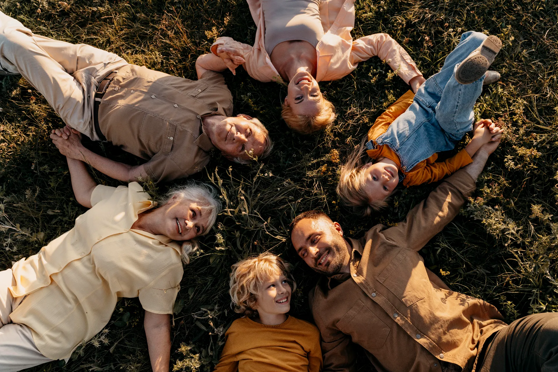 medium shot smiley people laying grass